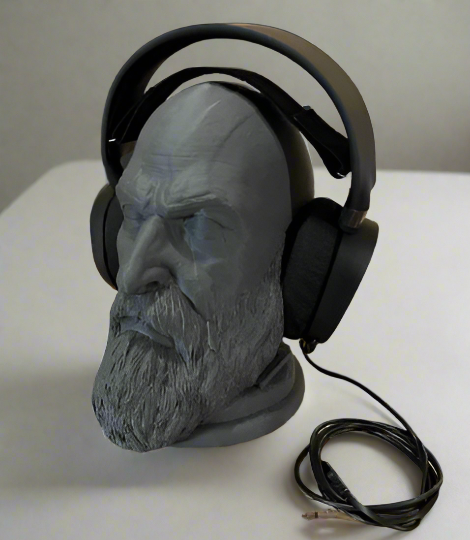 Headphone stand shaped like a bearded man's head