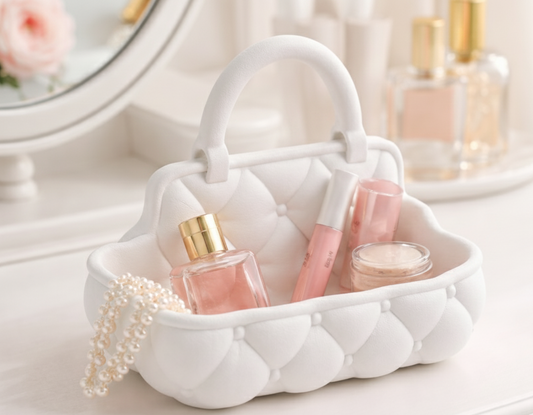 White decorative basket with beauty products and jewelry on a light background