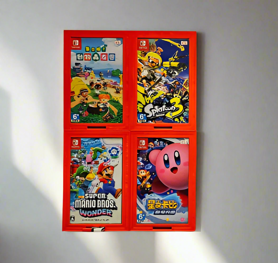 Set of video game cases on a red display stand against a light-colored wall.